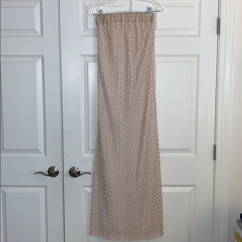 Champagne colored strapless maxi dress.